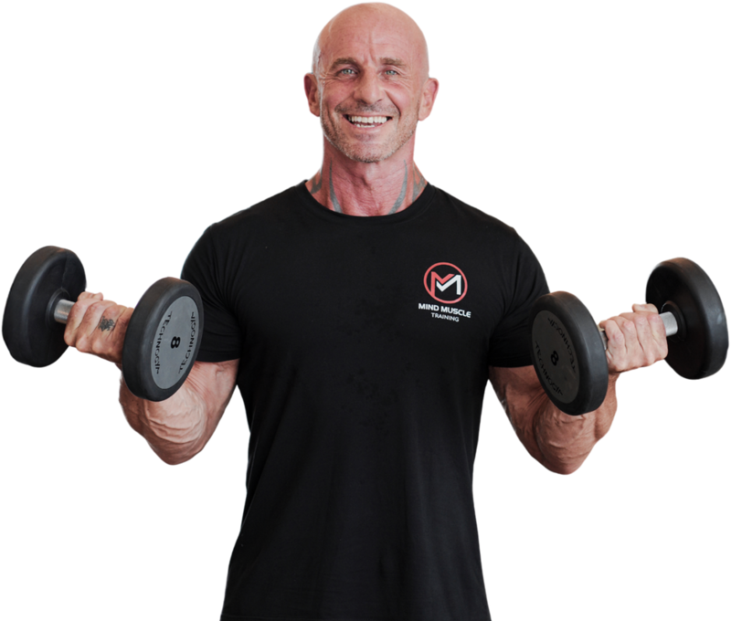 Ian, Da Nang personal trainer, holding dumbbells