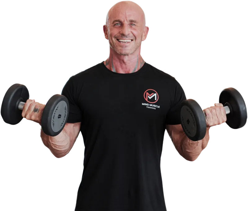 Ian, Da Nang personal trainer, holding dumbbells